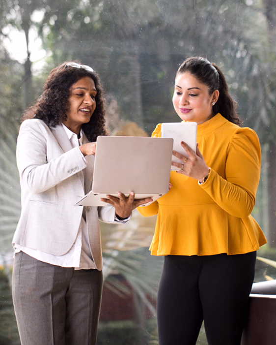 Two business professionals discussing digital solutions