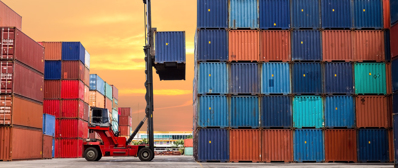 Shipping containers and cranes at a busy port terminal